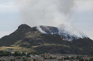 The smoke rises as a forest fire burns in Arthur's seat